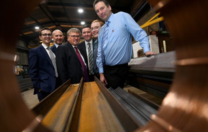 Business men in a manufacturing setting