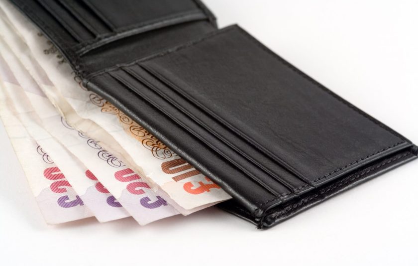 open wallet containing UK bank notes
