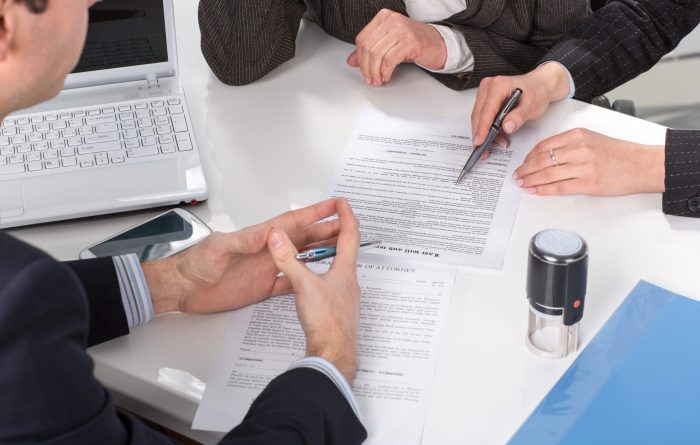 business people signing Lasting Power of Attorney