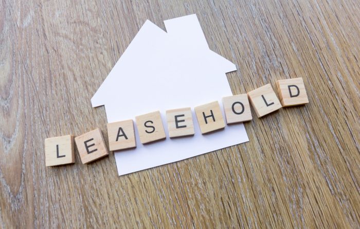 Leasehold spelt in letters over a paper house