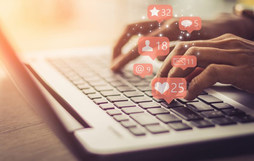 Social media dismissal - business woman on a laptop