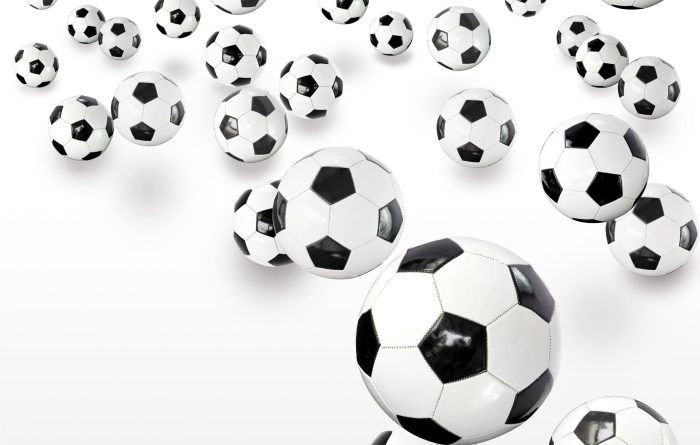 Lots of footballs against white background