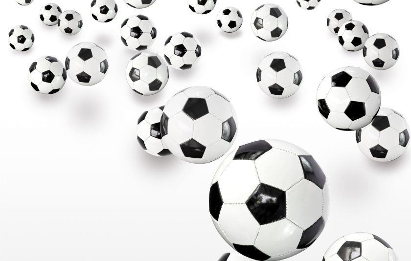 Lots of footballs against white background